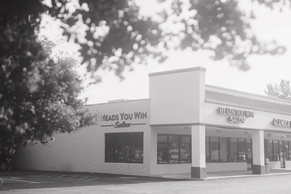 Heads You Win Salon storefront on Skylark Drive