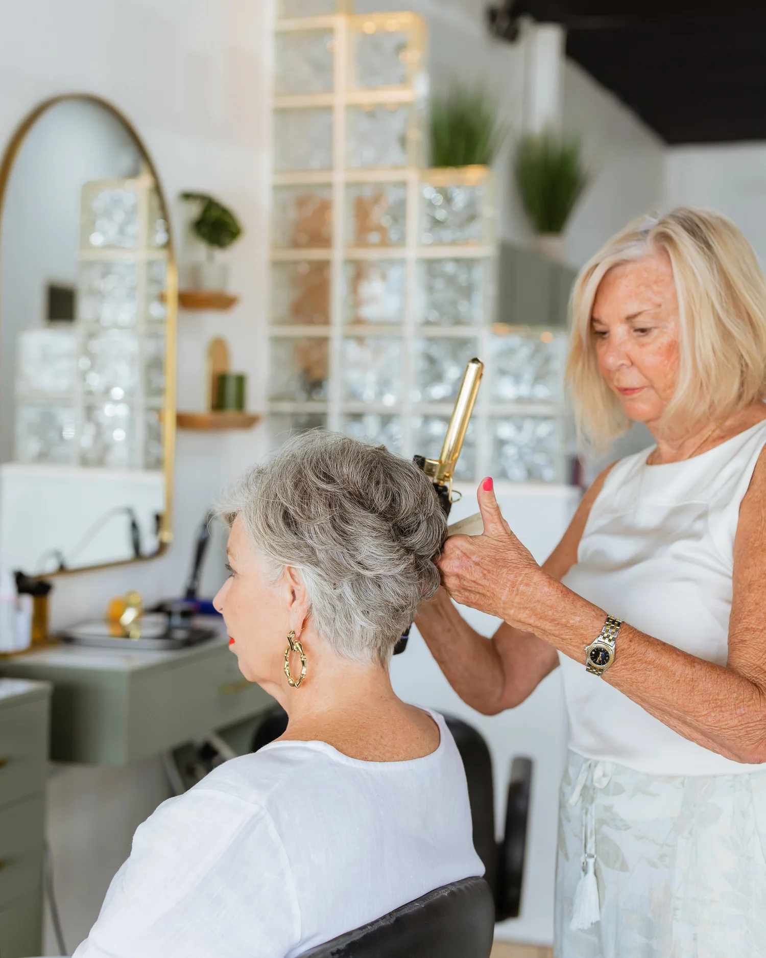 Stylist working on a client's hair color at Heads You Win Salon in West Ashley