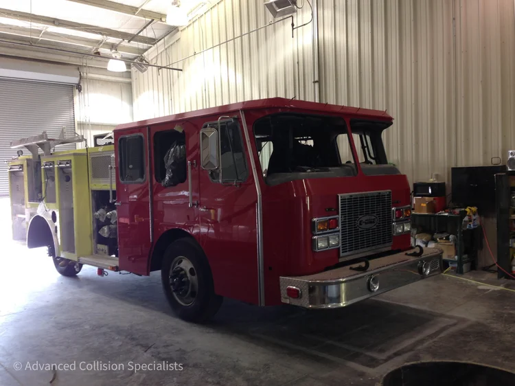 Finished red fire truck after full cab refinish – Advanced Collision Specialists, Burleson TX