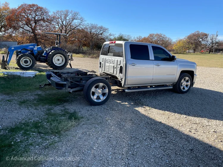 Silver Chevrolet Silverado with bed removed for repair – Advanced Collision Specialists, Burleson TX