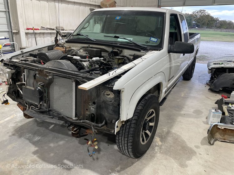 White GMC pickup with front end disassembled for repair – Advanced Collision Specialists, Burleson TX