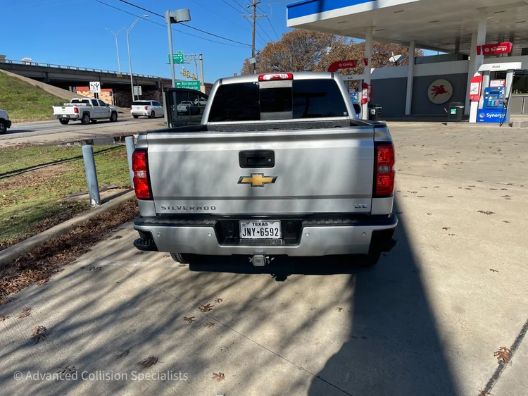 Silver Chevrolet Silverado after bed and rear repair – Advanced Collision Specialists, Burleson TX