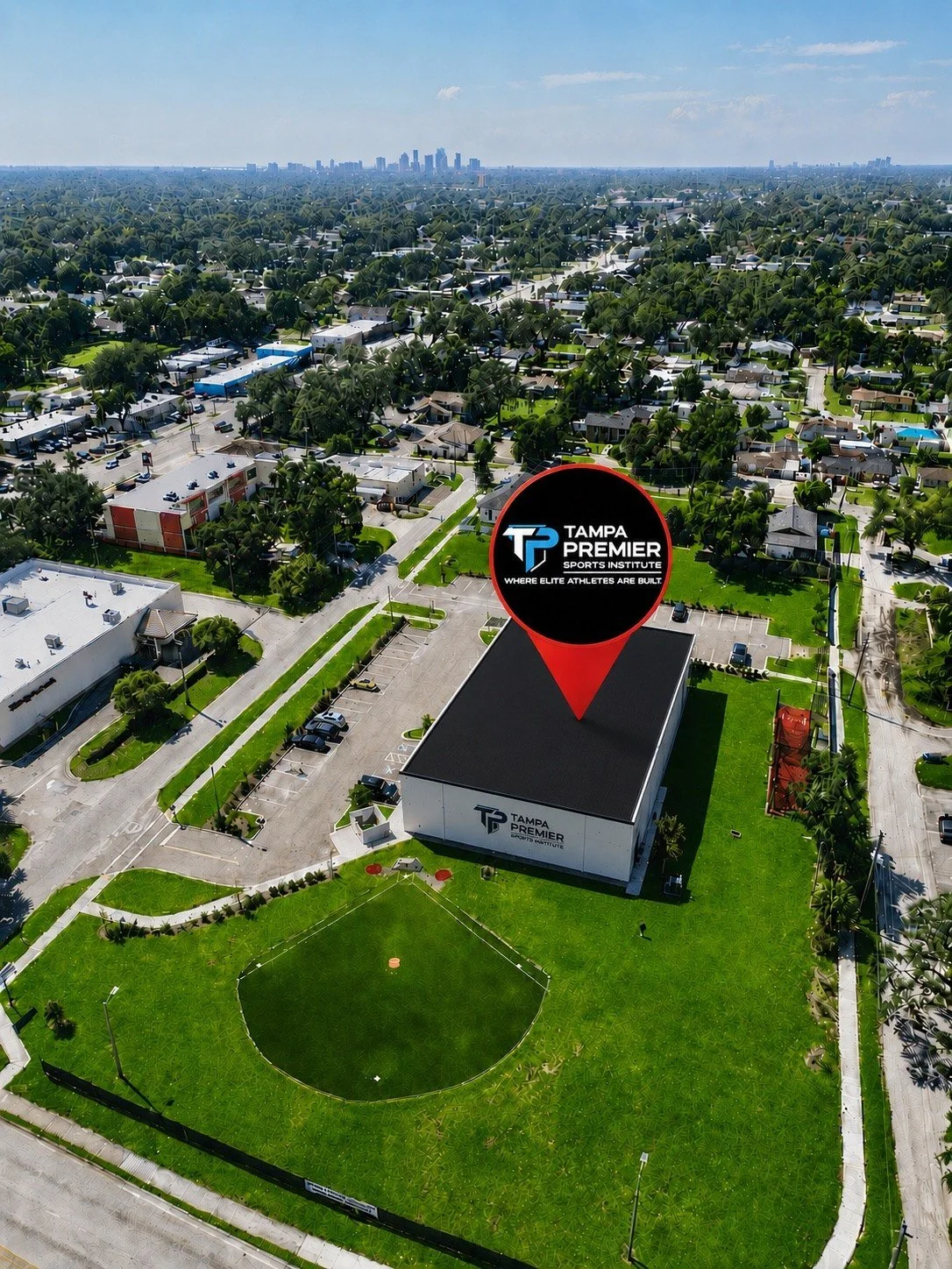 Aerial view of Tampa Premier Sports Institute and its outdoor field, with the Tampa skyline