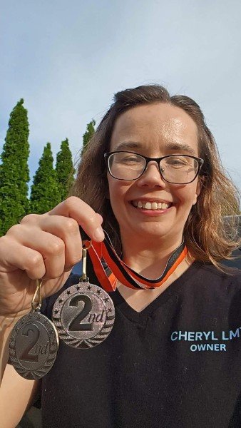 Cheryl with Tennessee Massage Championship medal