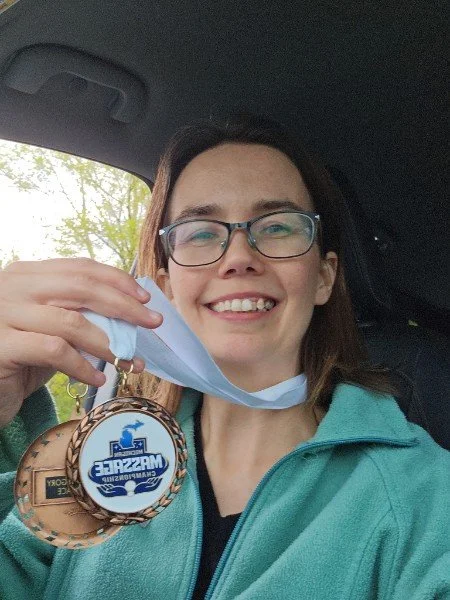Cheryl with Michigan Massage Championship medal