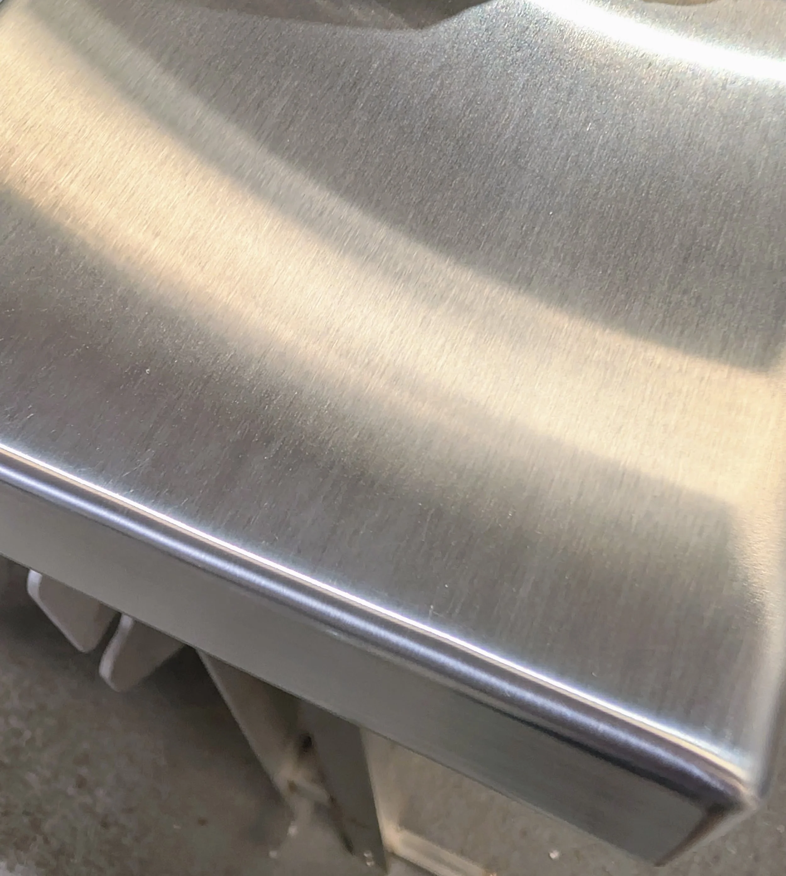 Hand TIG welding the 316 stainless steel tub in the workshop.