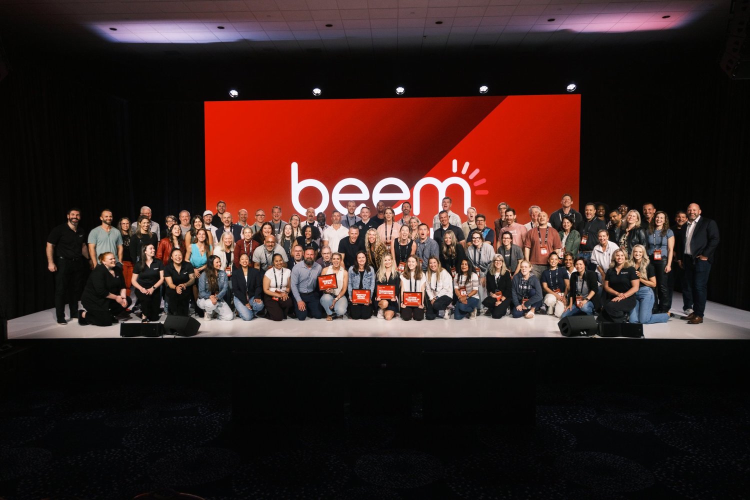 beem® owners together on stage with their awards