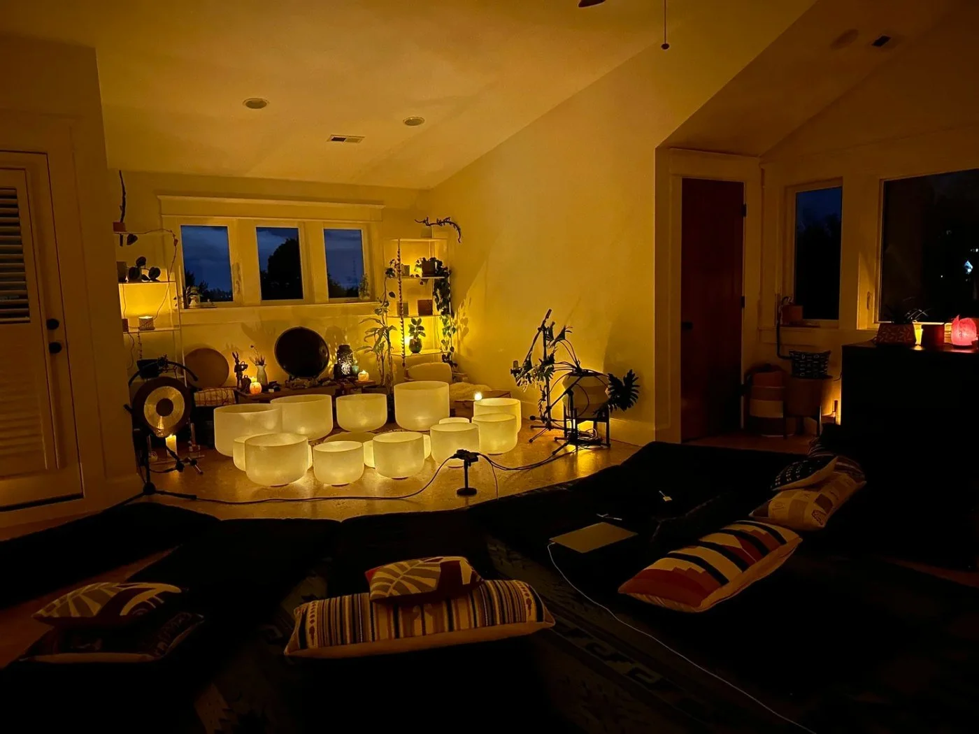 The Attic, Graham Slick's sound bath studio in SE Portland: crystal bowls in a ring under candlelight