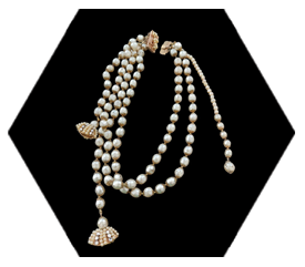 Unsigned Vintage Miriam Haskell Pearl Necklace on a black hexagon background