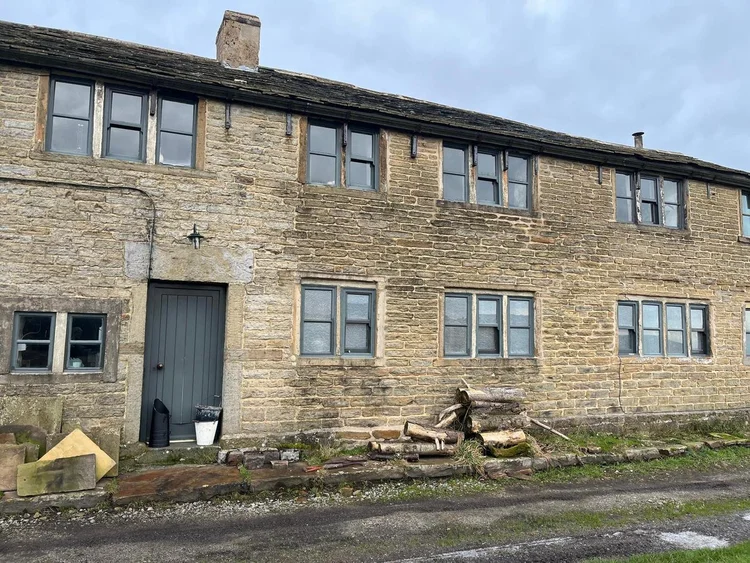 Stone property on Springhead Lane, Huddersfield, before mortar removal and stonework repairs
