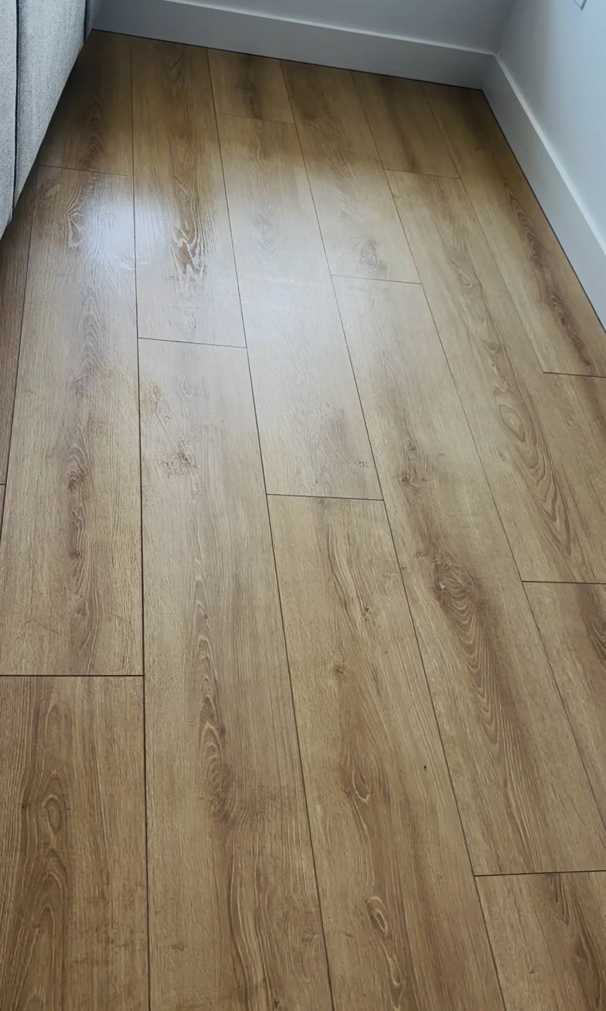Wood floor gleaming and spotless after vacuuming and mopping