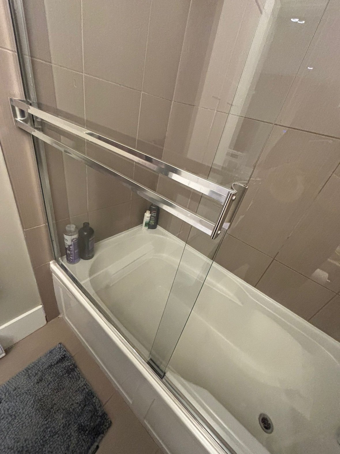 Shower glass door sparkling clear and streak-free after cleaning