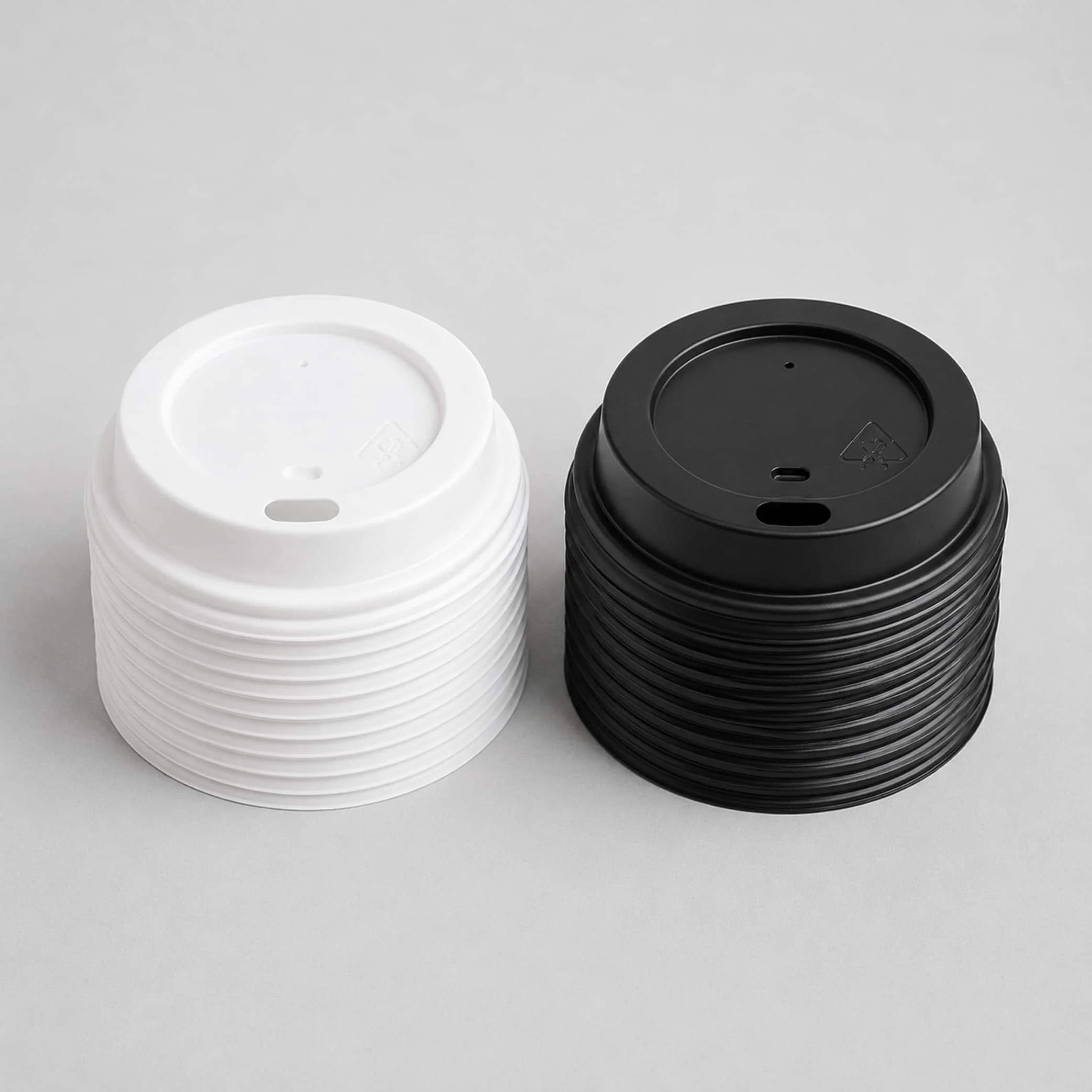 Black and white sip lids for paper coffee cups