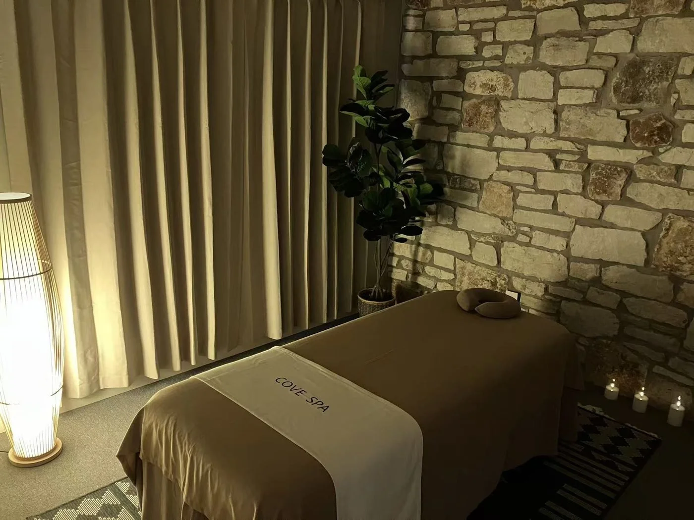 Stone-wall massage room at Cove Spa