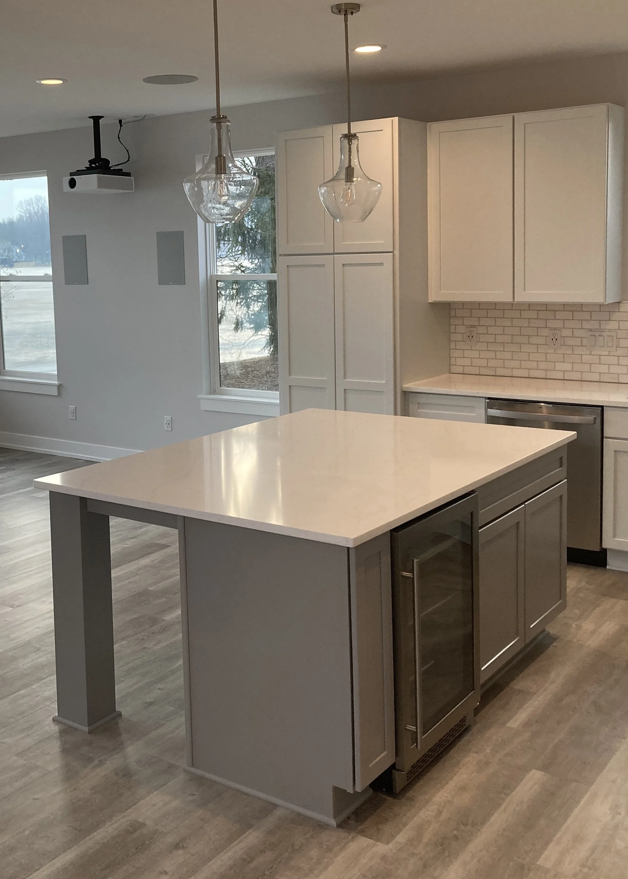 island features a mini wine fridge