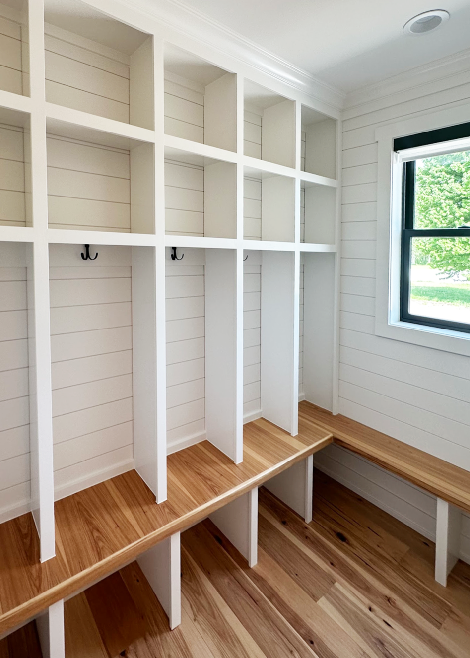 mudroom with custom built-in farmhouse lockers