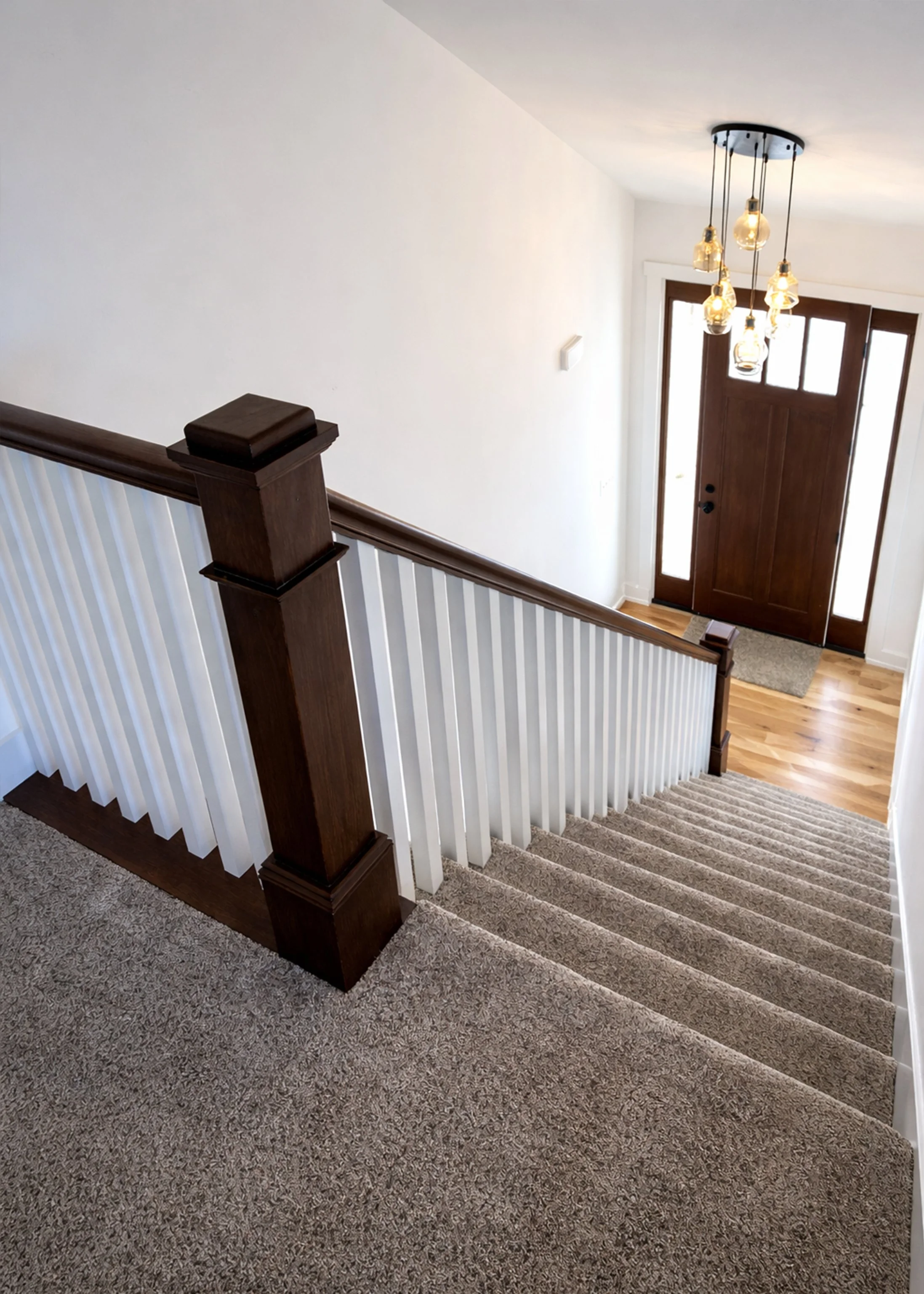 Beautiful stained craftsman stair rail and newel post