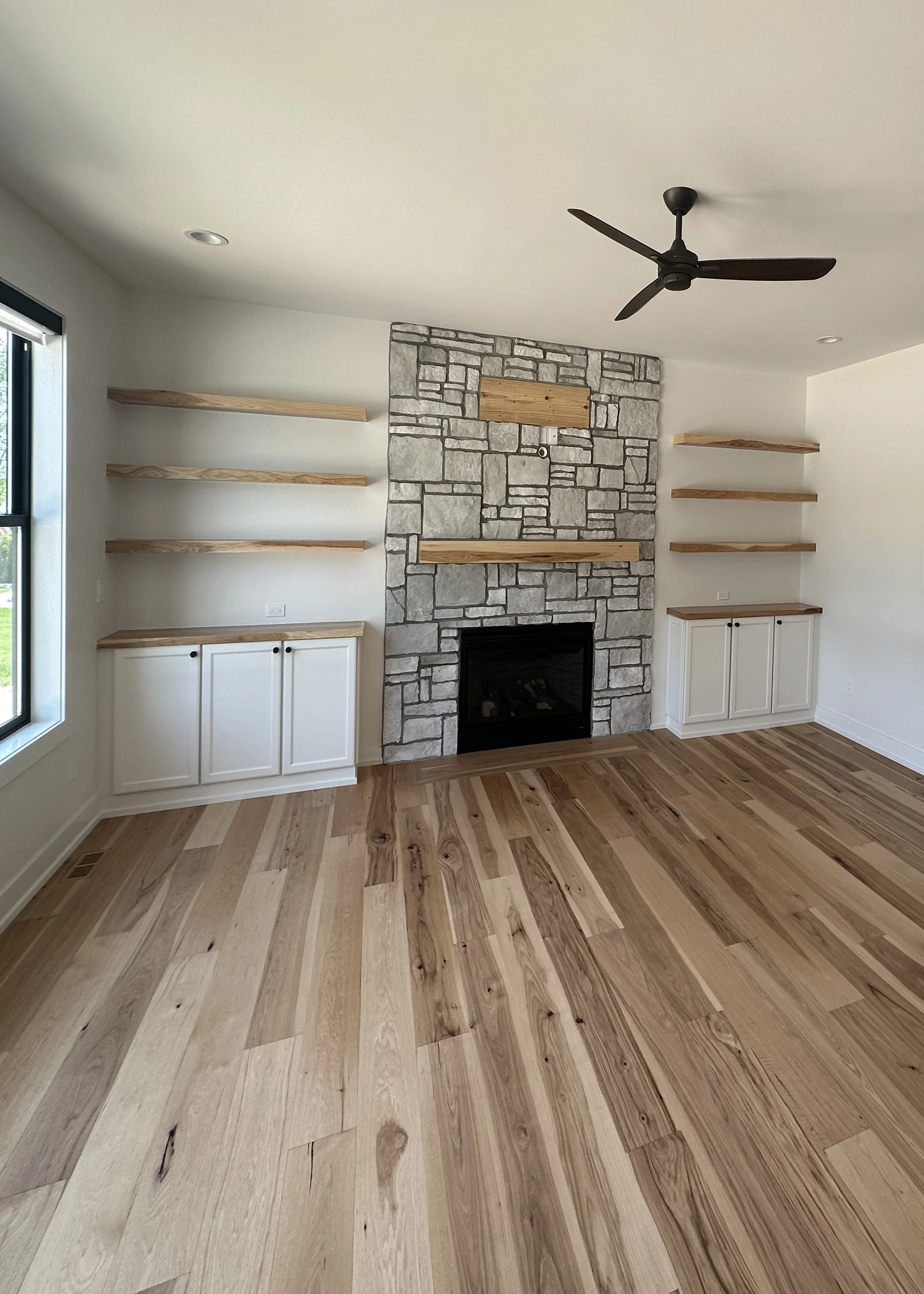 custom built stone fireplace with build ins