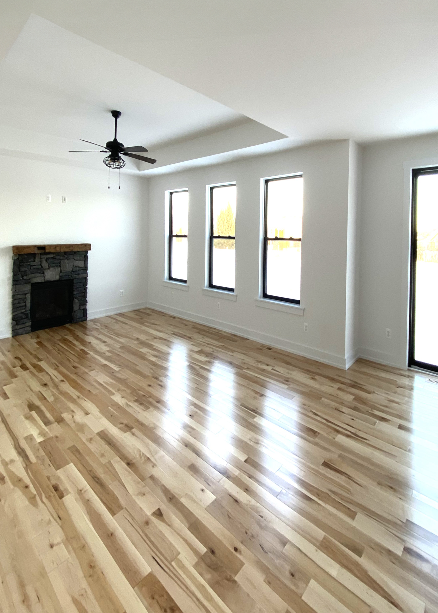 custom built stone fireplace in open concept family room