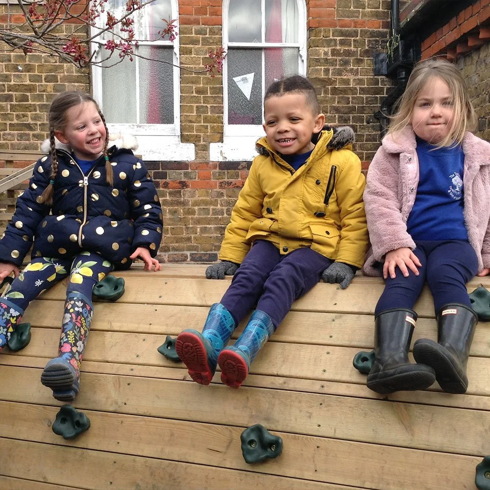 happy children on a climbing frame
