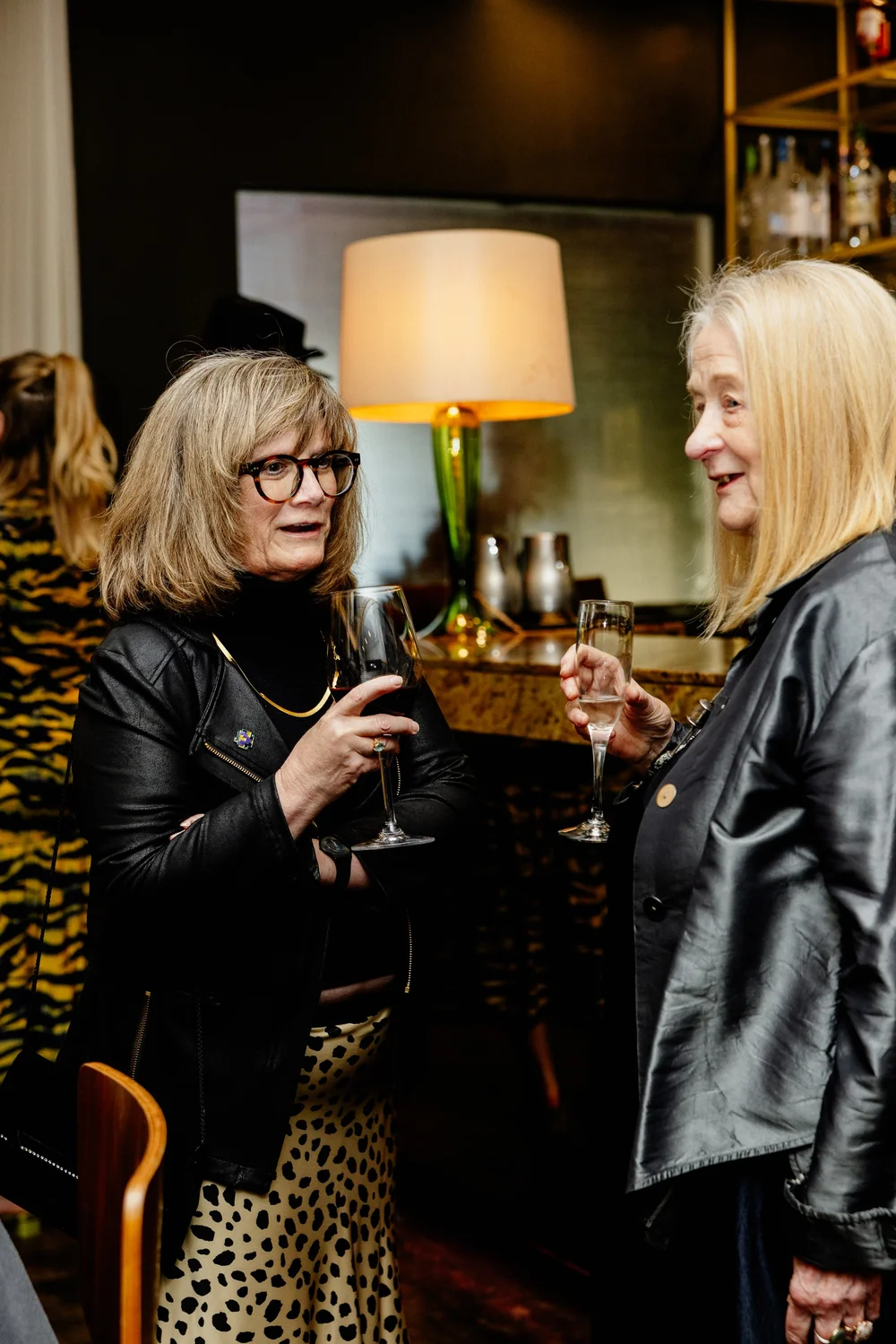 Two guests converse at the 2026 Salum reception.
