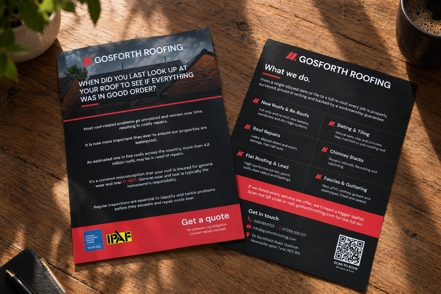 Gosforth Roofing leaflets on a wooden table in sunlight