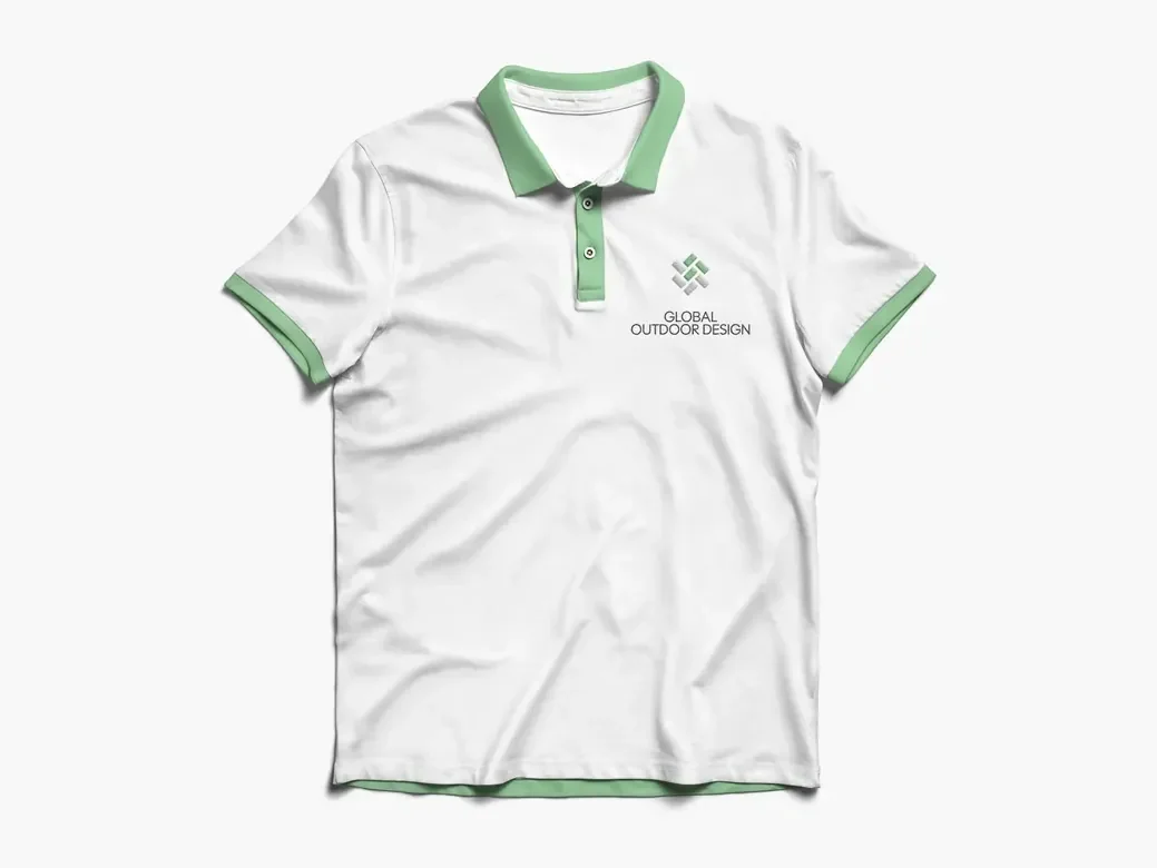 White polo shirt with a green collar and cuffs, the Global Outdoor Design mark and name embroidered on the chest