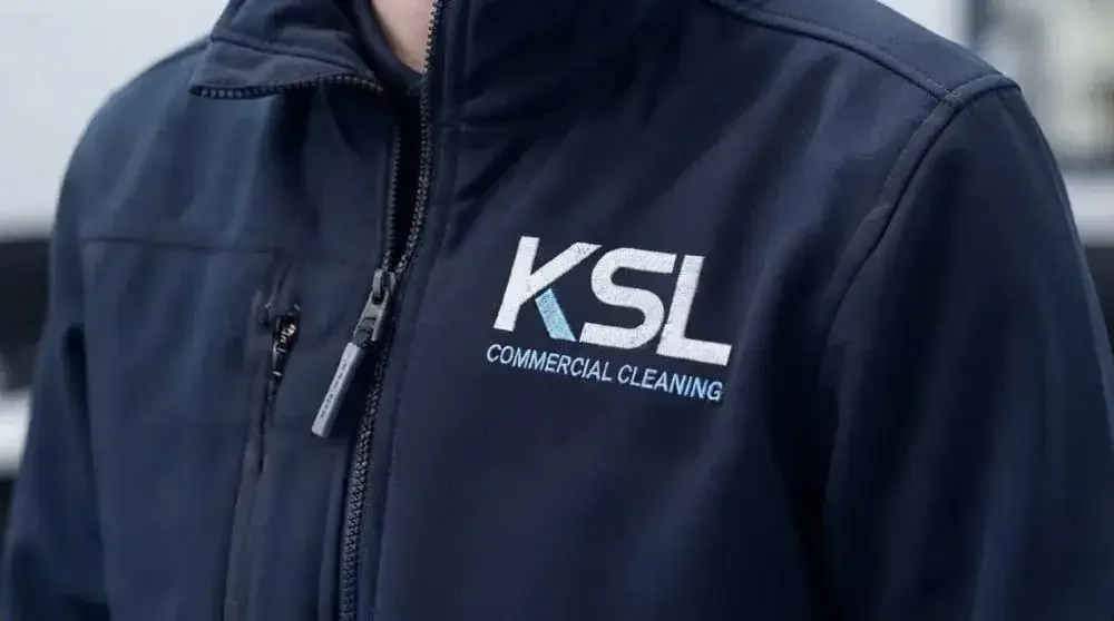 KSL logo embroidered on a navy work jacket