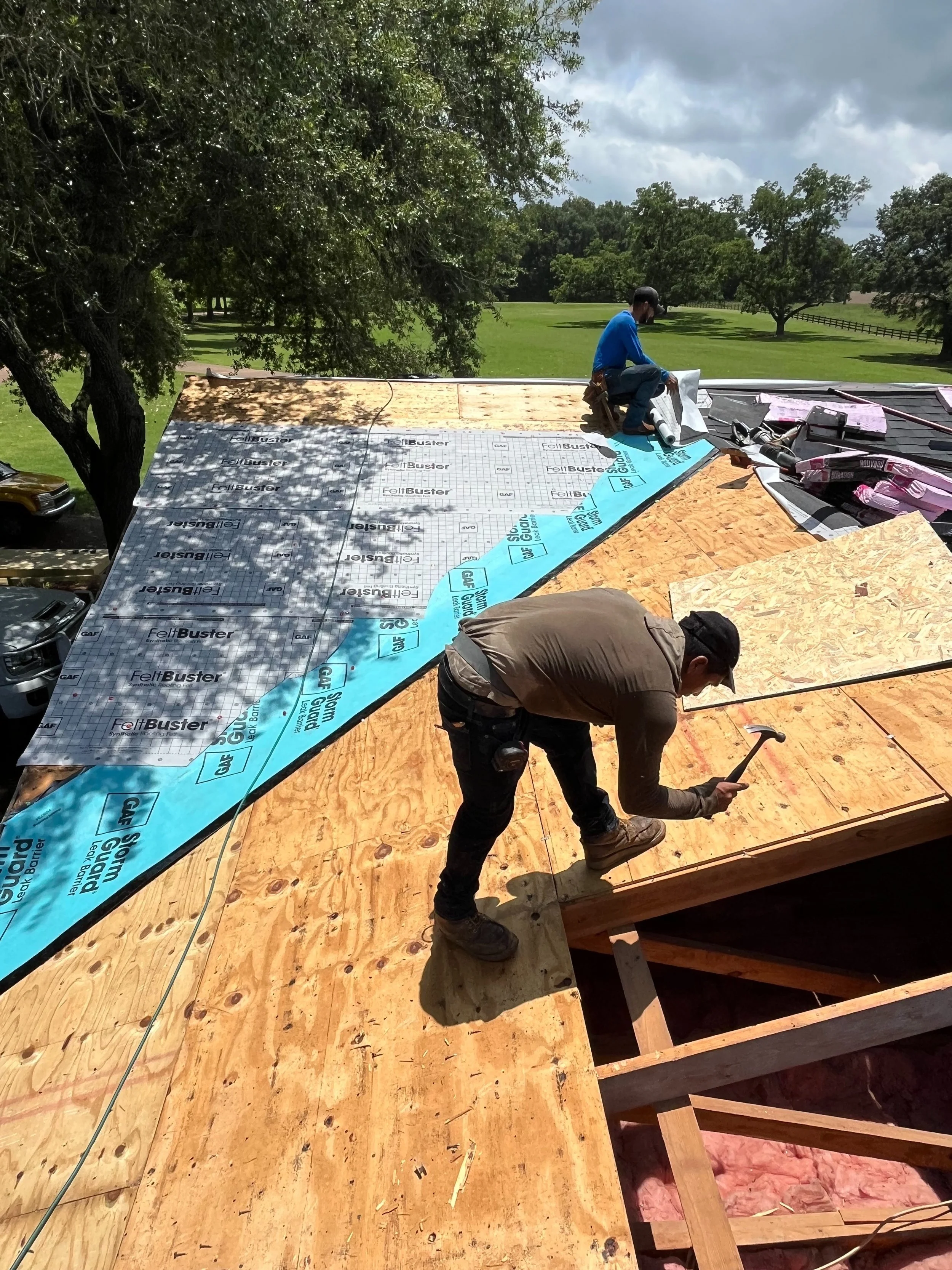 Resto Construction crew member installing a roof in Mississippi