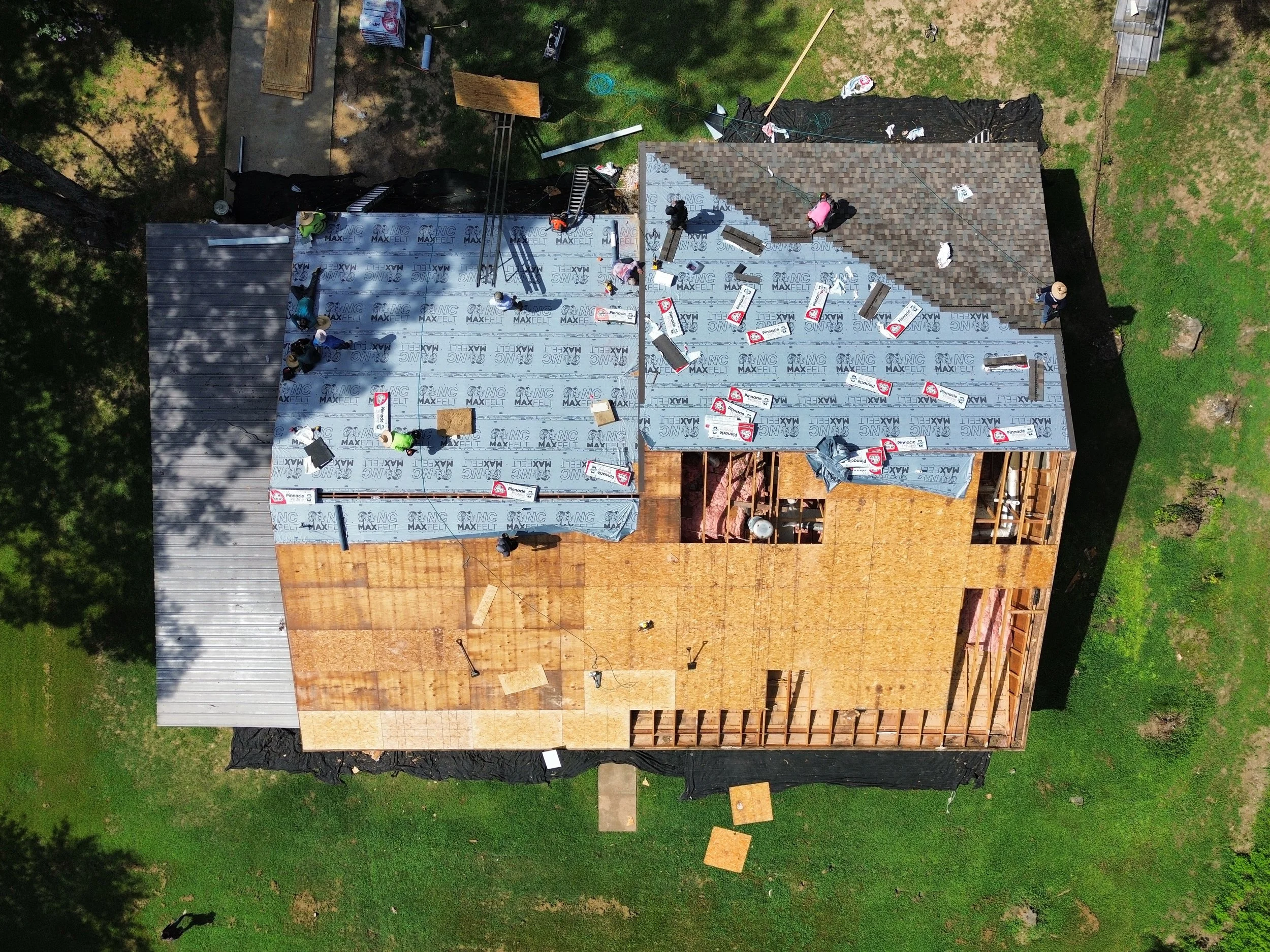 Roof under construction mid-progress inspection by Resto Construction