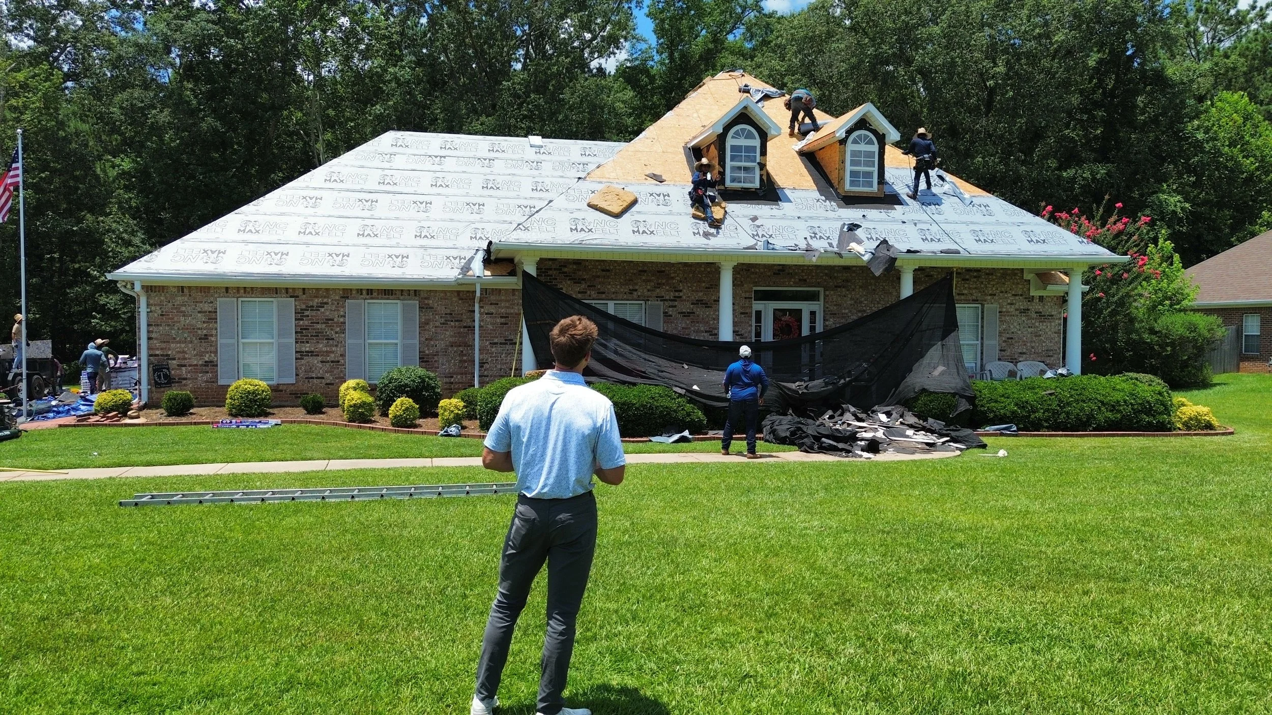 Resto Construction crew member installing new roof in Mississippi