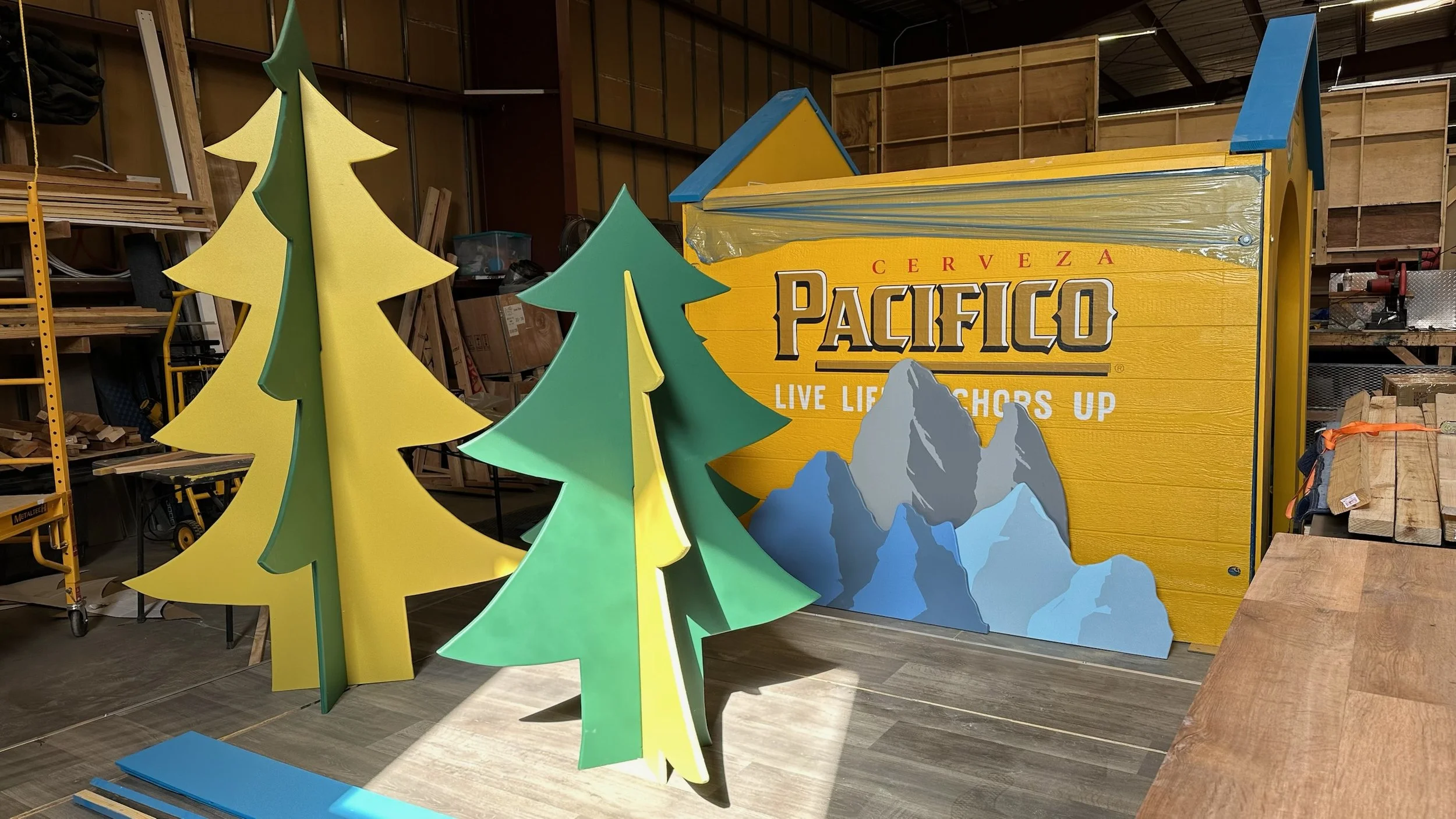 Hand-built mountain and pine tree set pieces for the Pacifico activation