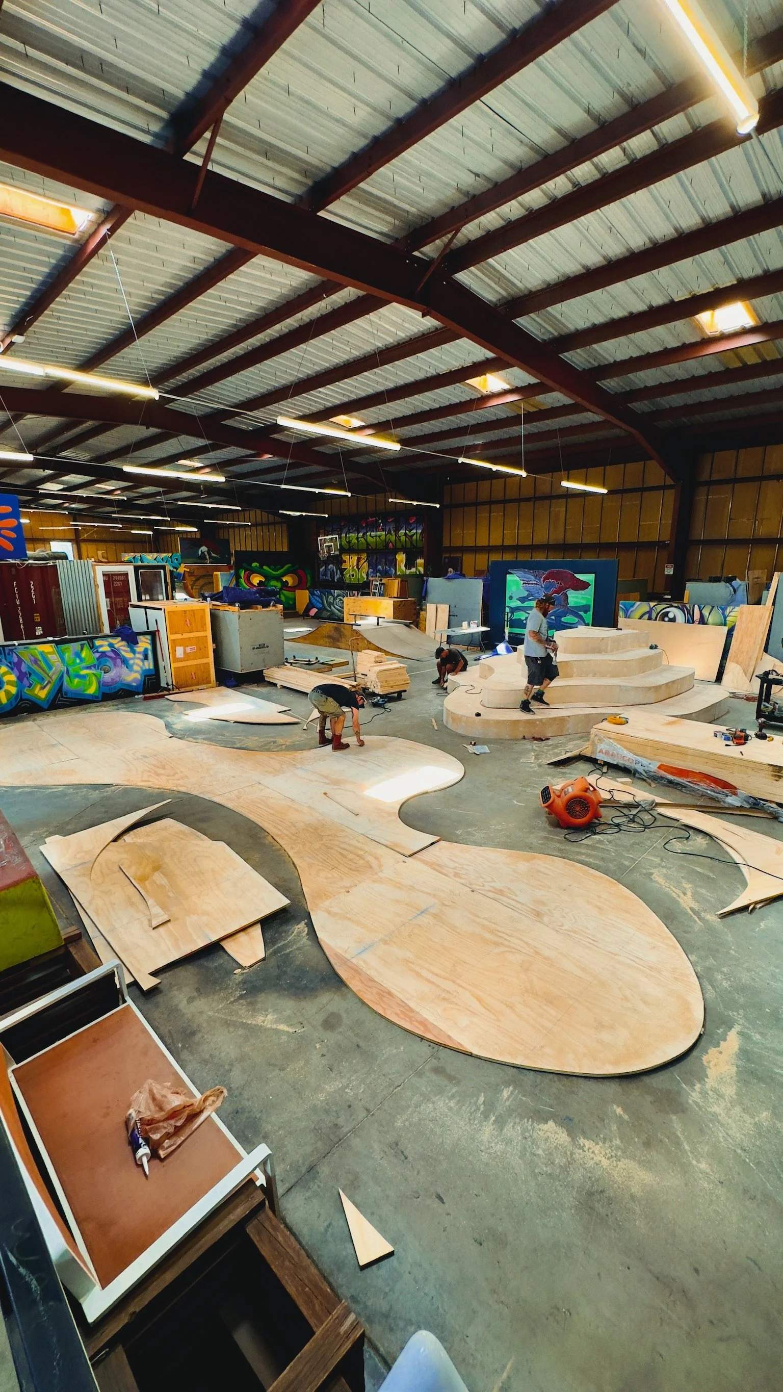 Curved plywood sections laid out in the shop