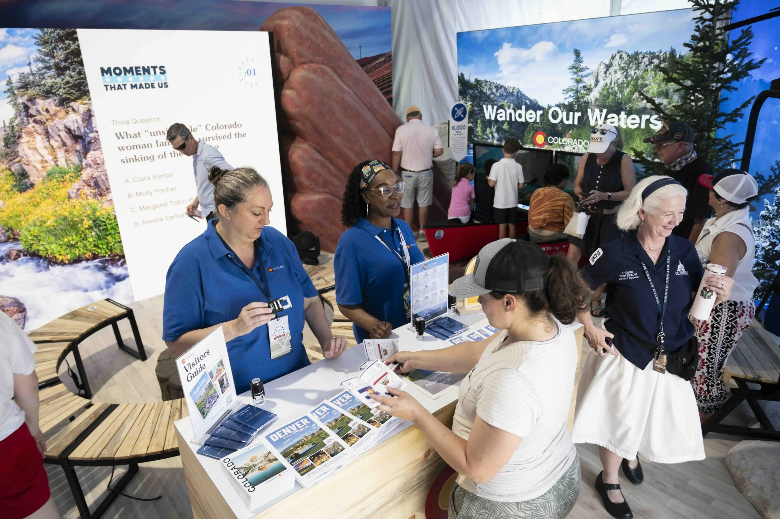 Colorado Tourism staff engaging visitors at the trivia station