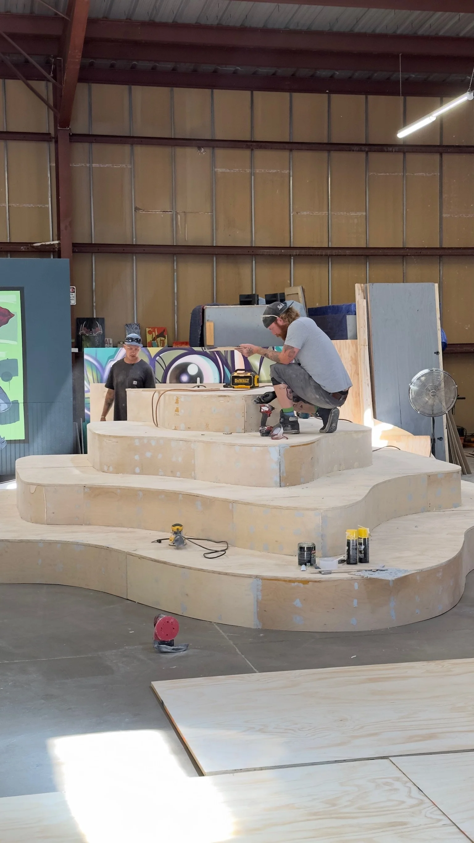 Raw plywood structure under construction in the shop