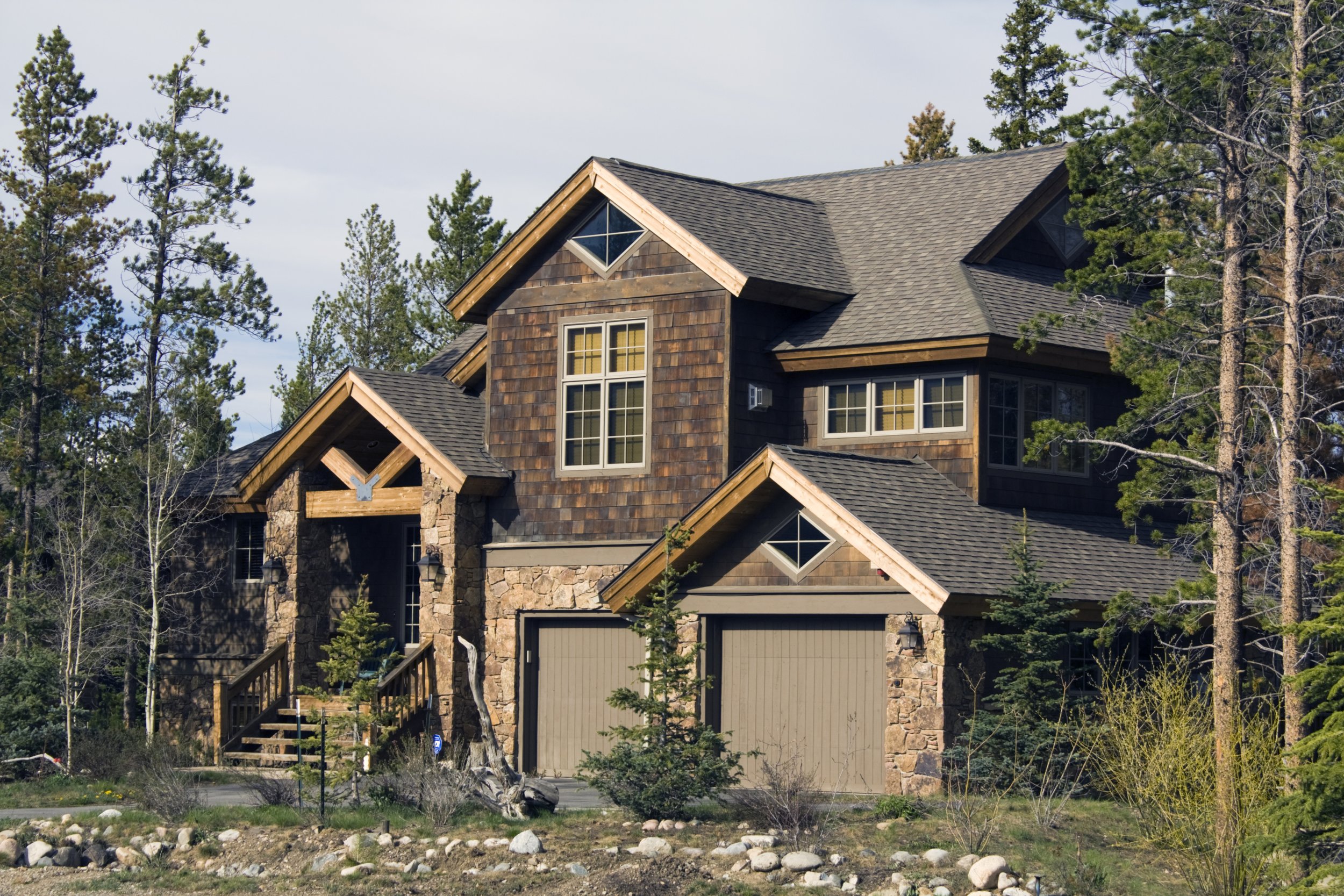 Mountain home exterior with stone and timber details