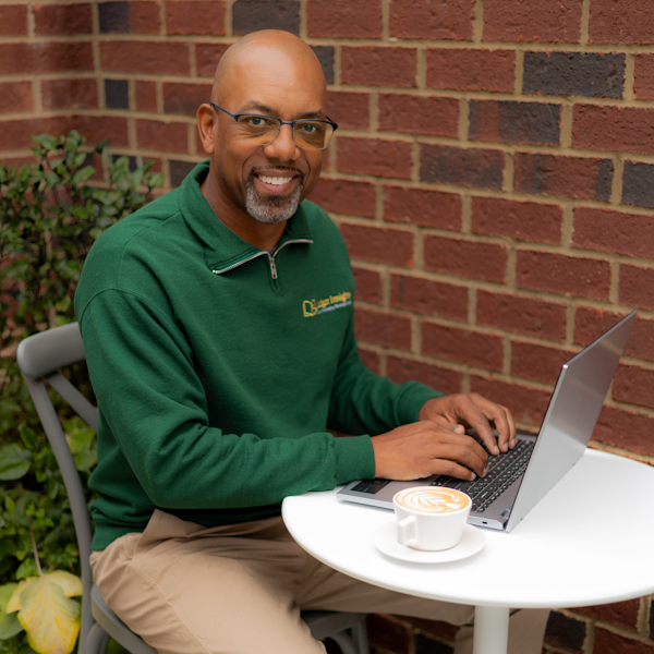 Brian, founder of Ledger Insights Bookkeeping, working at his laptop.