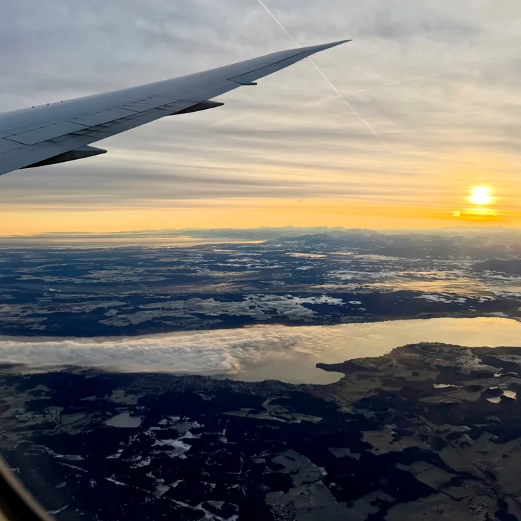View from a plane window at sunset