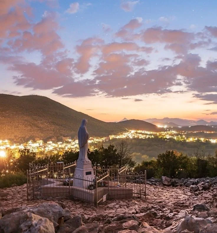 Statue of Our Lady on Apparition Hill at sunset