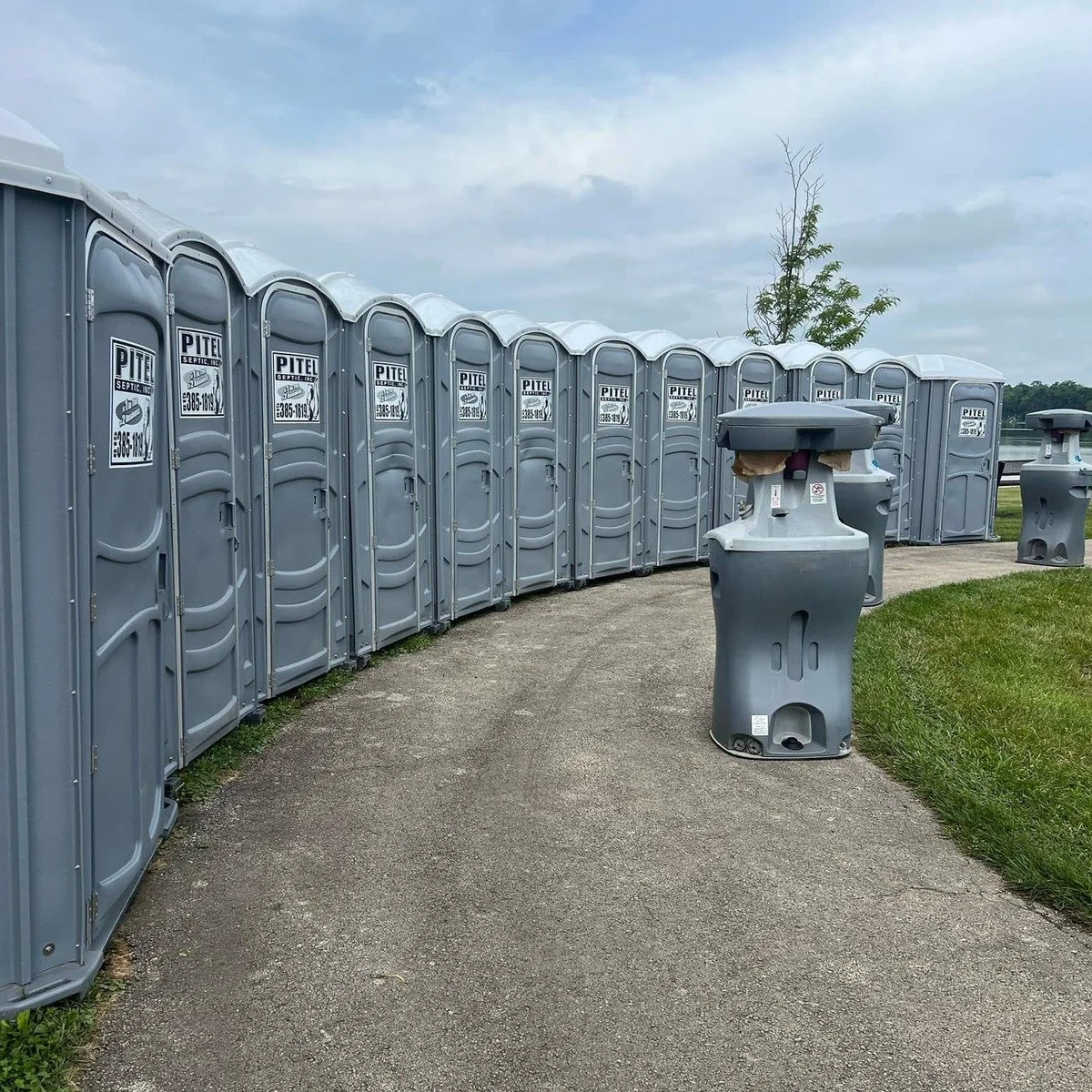 Portable restrooms placed on stable, serviceable ground for construction toilets and fencing near me in Brickell, FL.