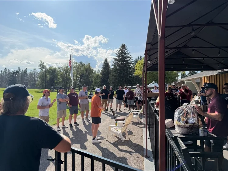 Golfers gathered outside the clubhouse after the round