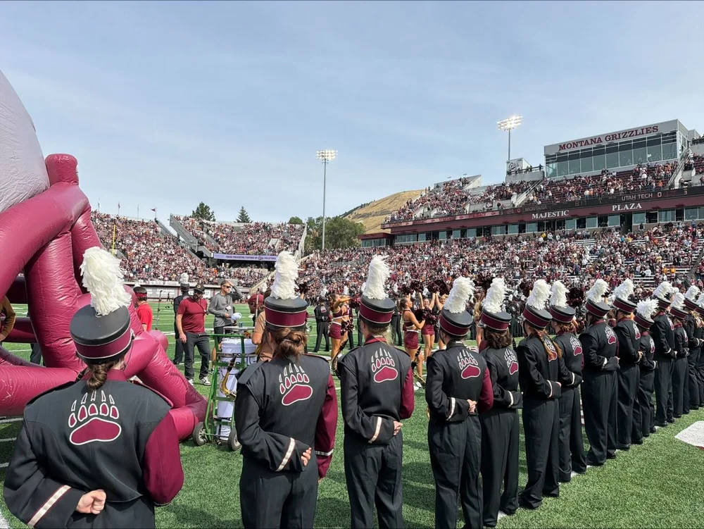 The Griz marching band lined up on the field before kickoff