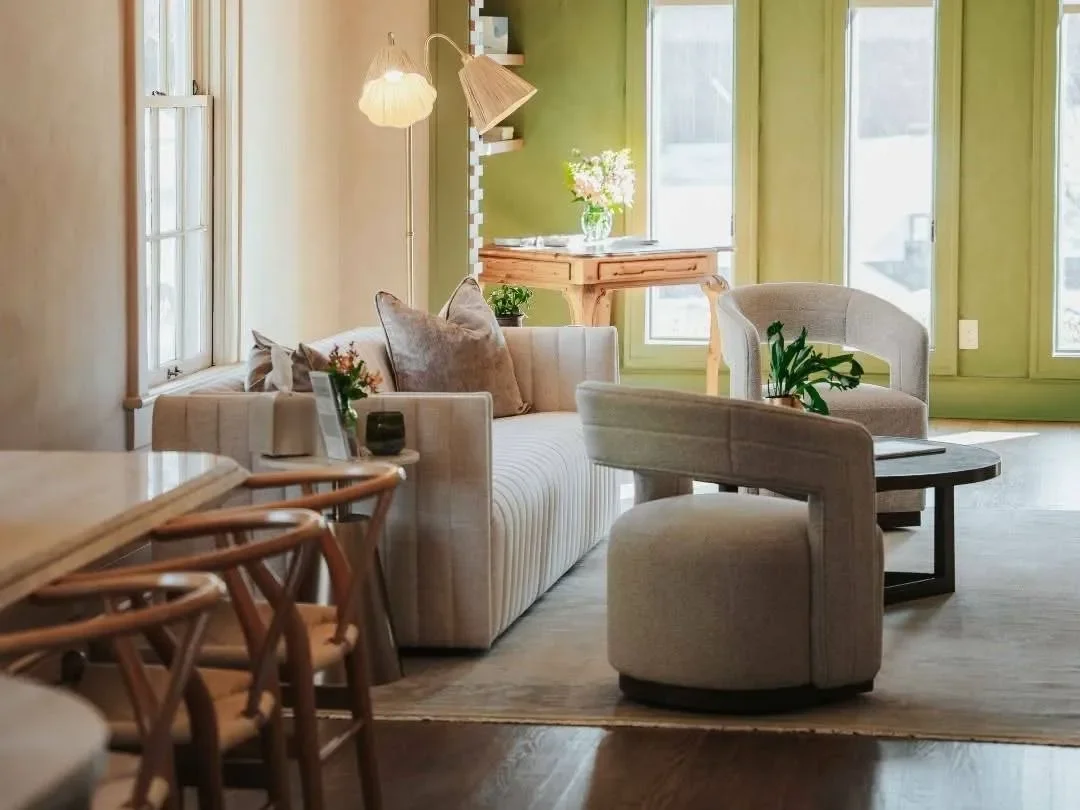 A reception space at Blume Wellness with a furniture set at its center.