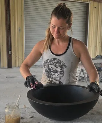 Rachel working on a black concrete bowl vessel in the Calhoun studio