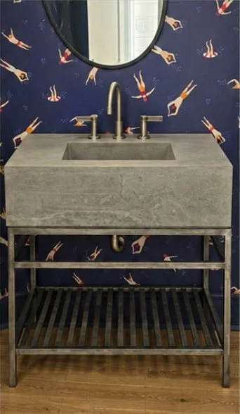 Jetty Stone Light Palmetto Block sink on an open metal base in a wallpapered powder room