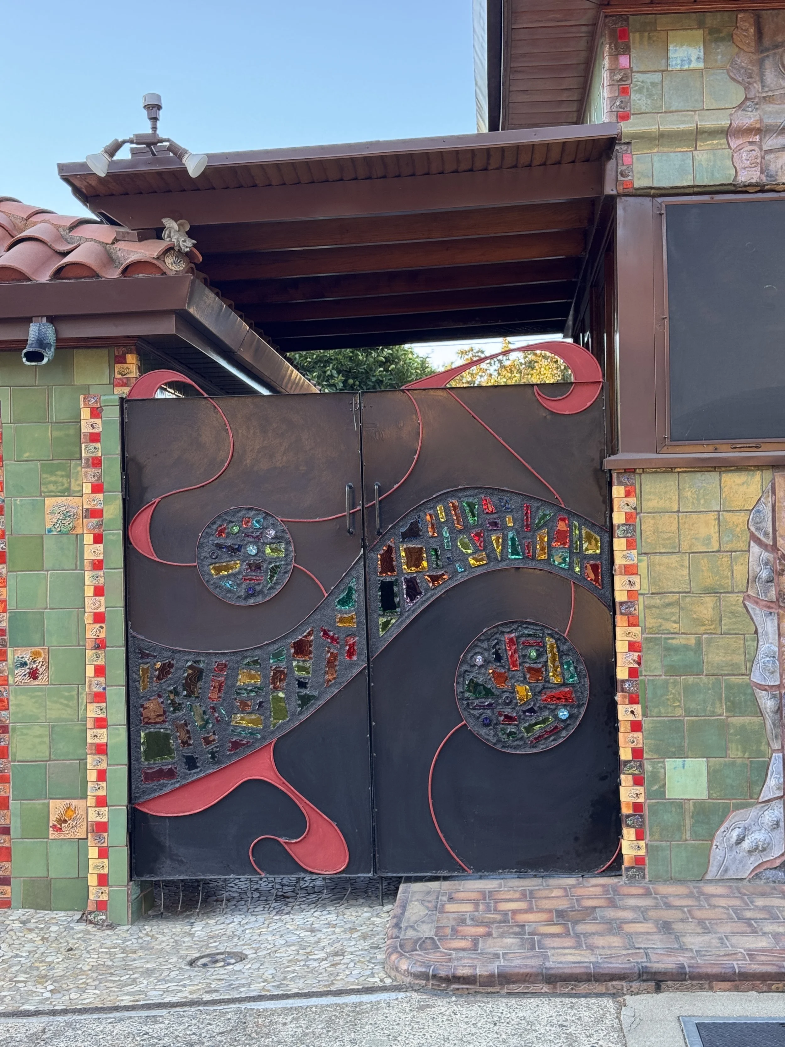 Decorative metal gate with colorful glass mosaic pieces at Sacramento’s Dragon House.