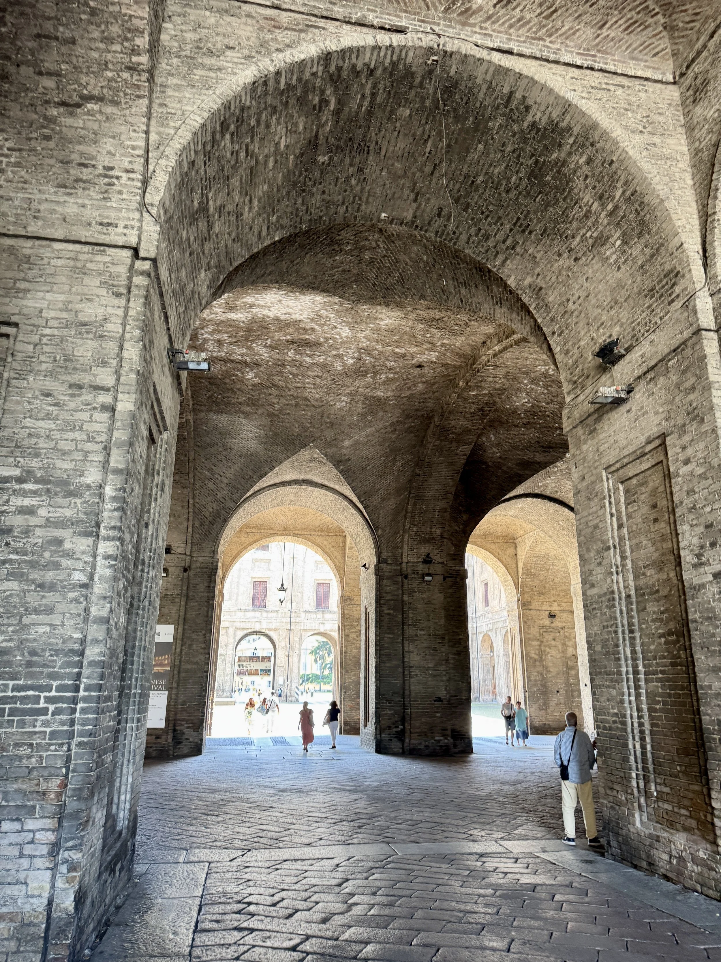 Brick arches inside Palazzo della Pilotta in Parma