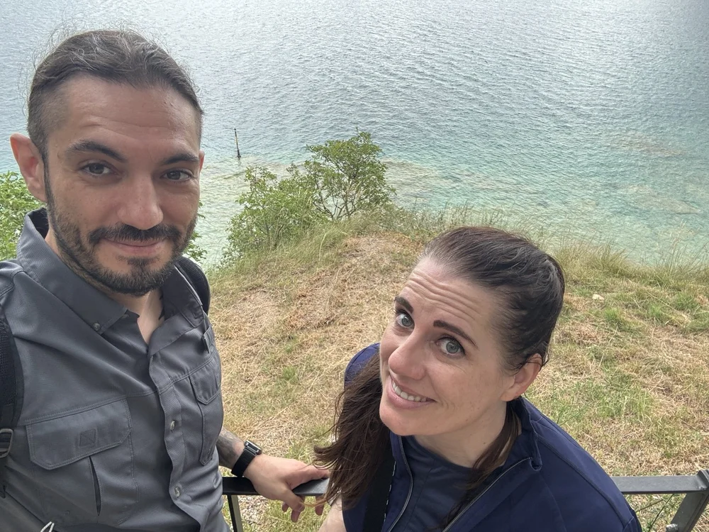 Couple at Grotte di Catullo with Lake Garda below in Sirmione, Italy