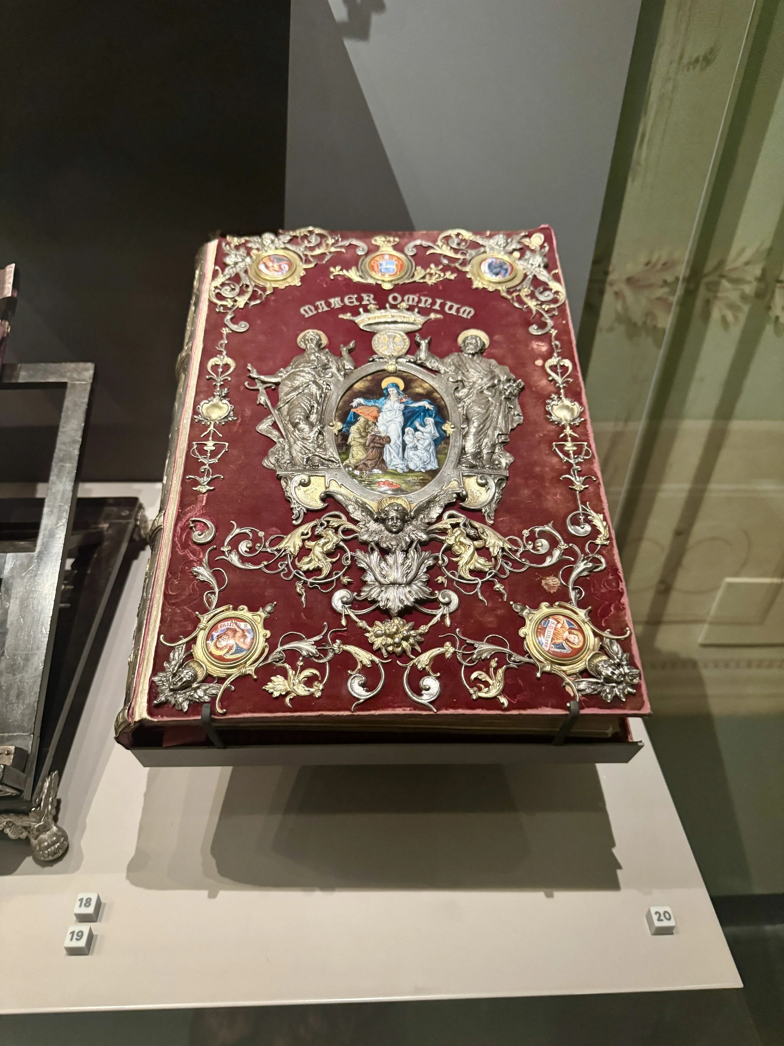 Ornate red and silver religious book cover in Pisa’s Duomo Museum