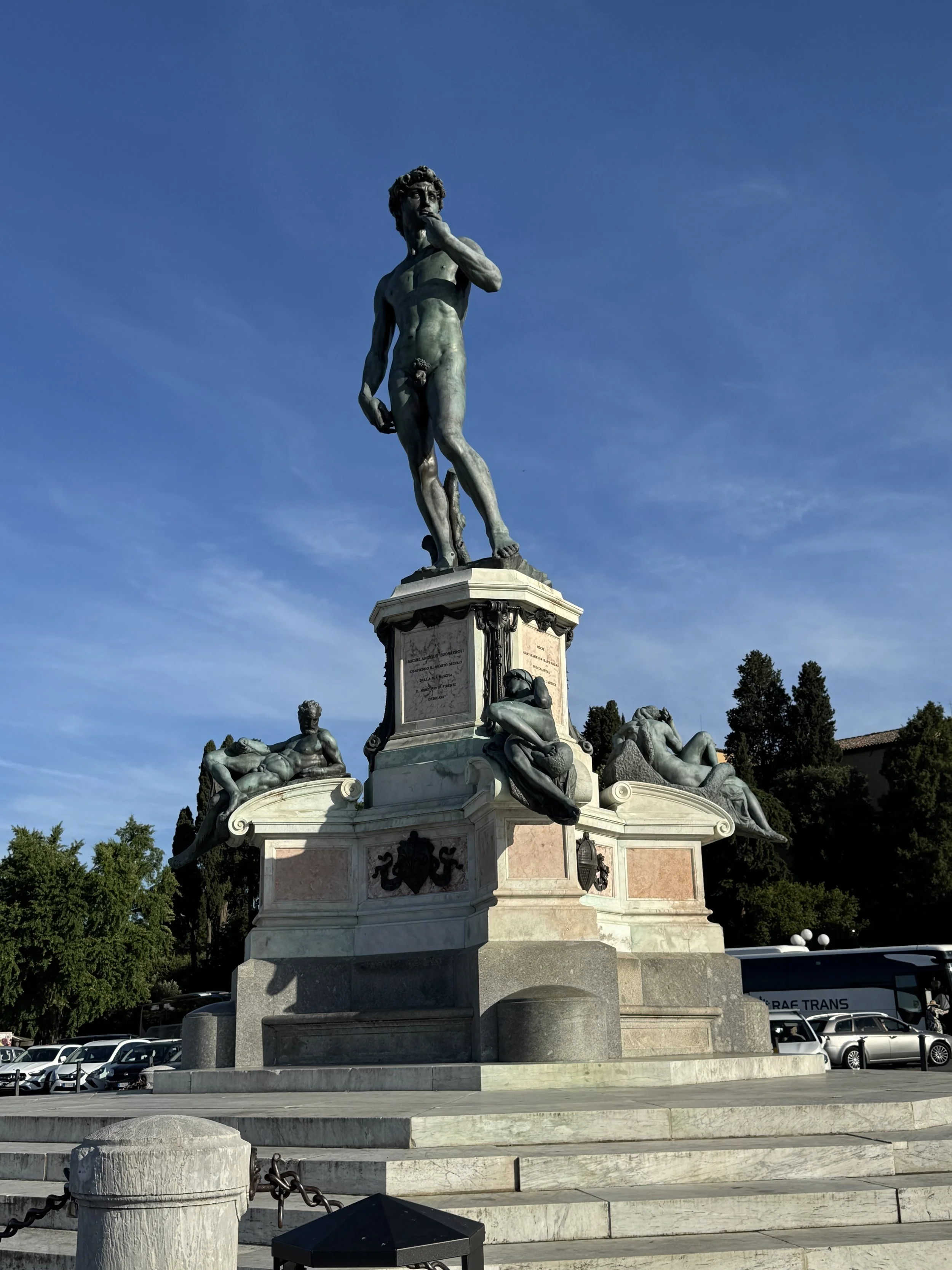 Bronze replica of Michelangelo’s David at Piazzale Michelangelo beneath a blue sky.